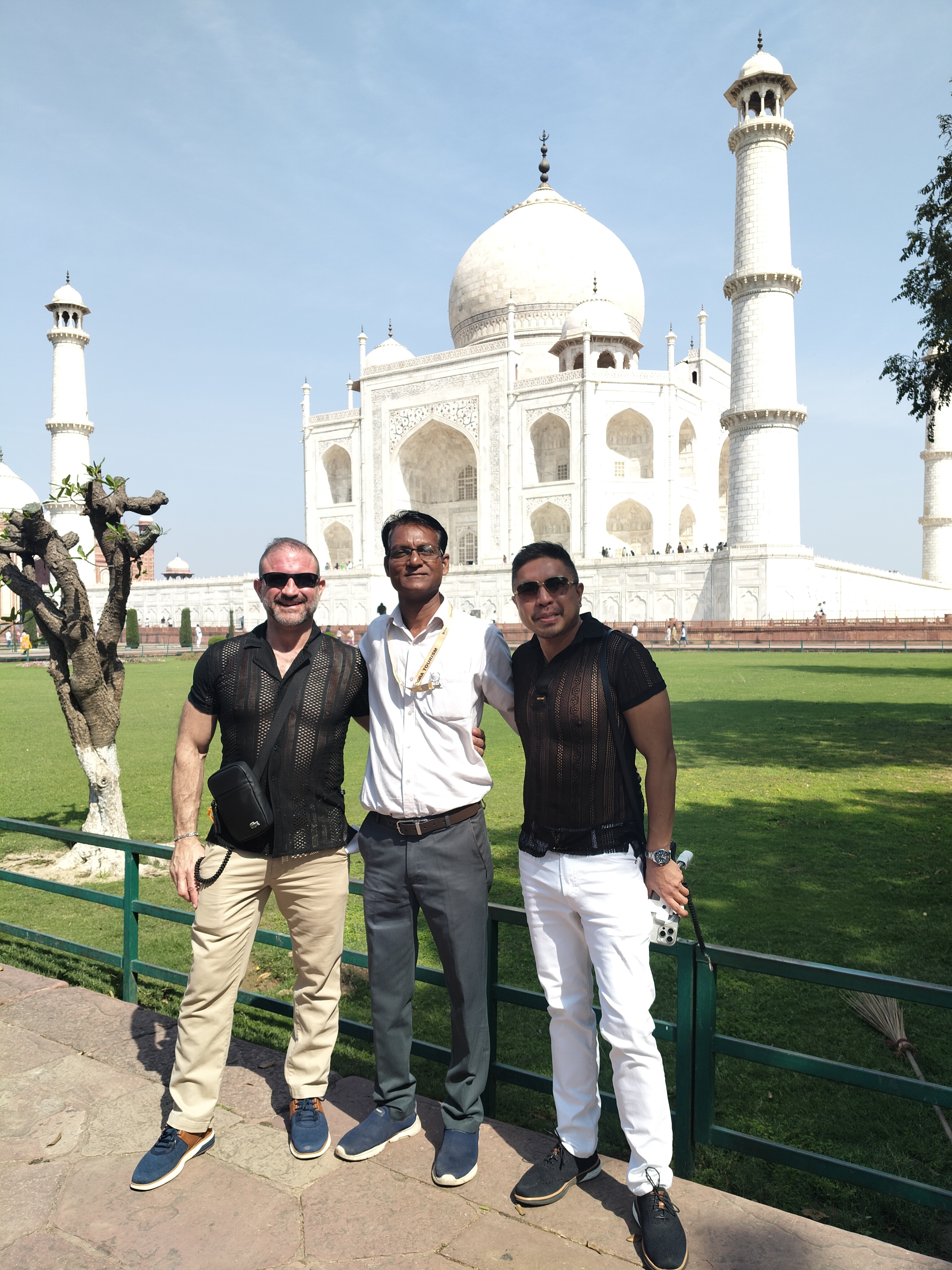 Mr. Verma with tourists smiling